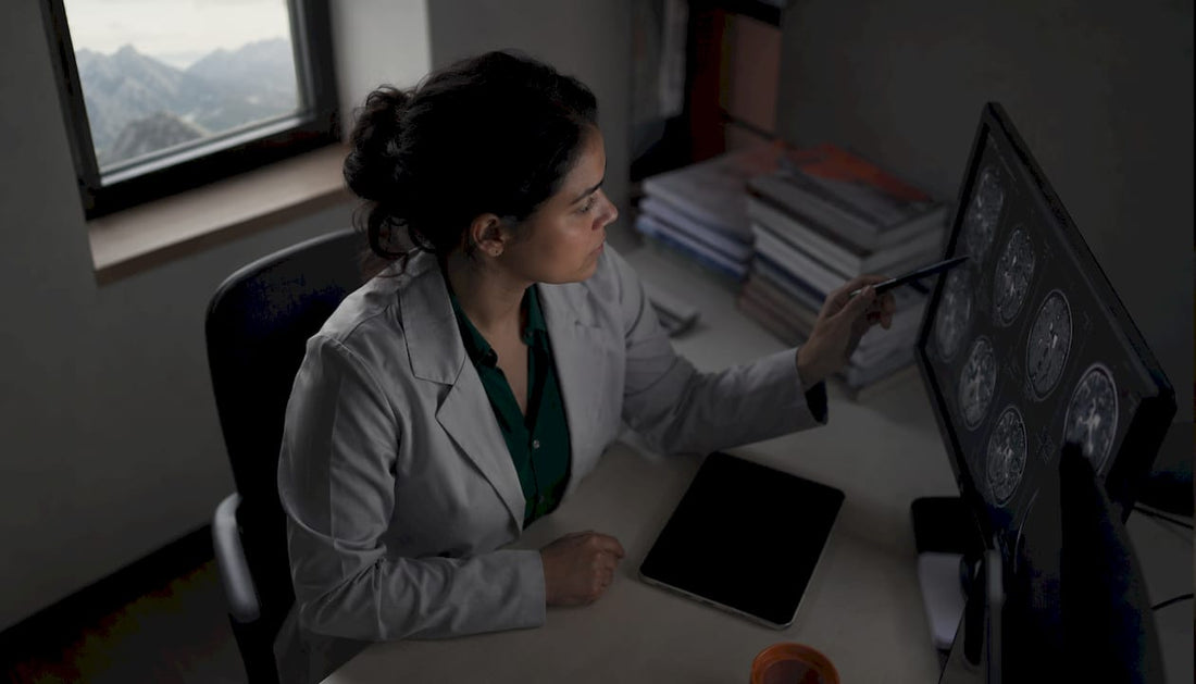 Scientist studying brain scans with mountain view