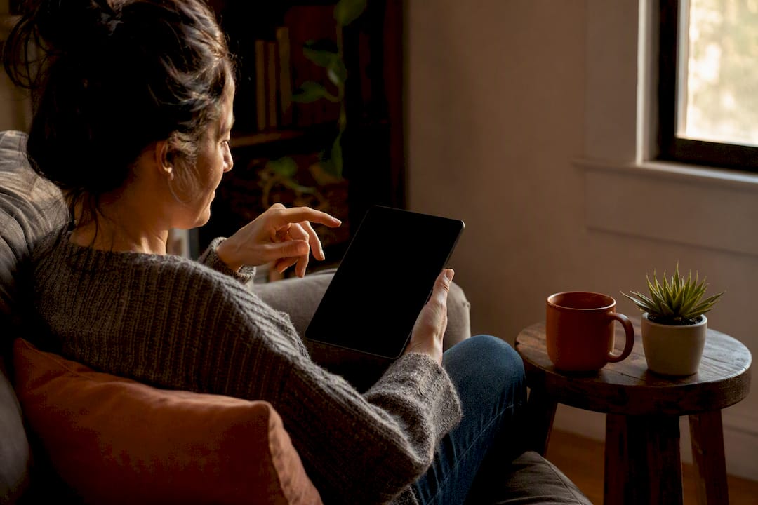 Adult holding tablet ready to start ADHD checklist