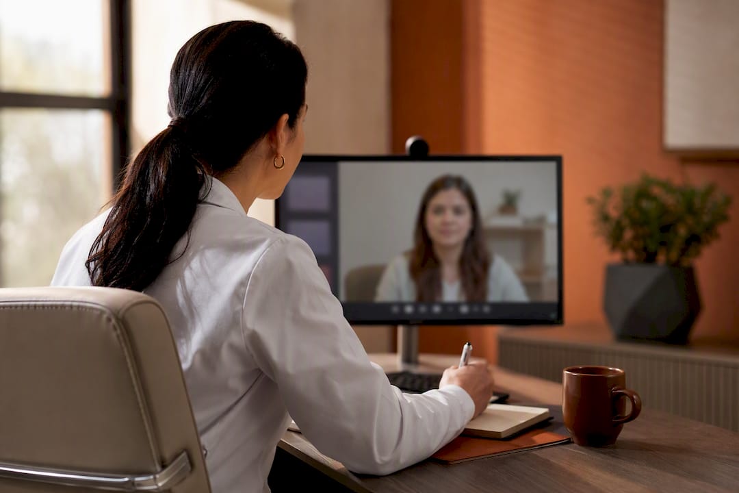 Clinician conducting a remote medication evaluation