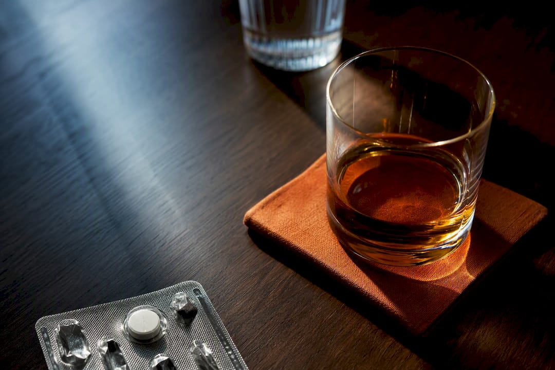 Medication and alcohol arranged for safety editorial